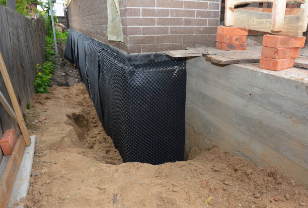 SJ Waterproofing Pros technician performing targeted Vapor Barrier Installation assessment in Goshen, IN